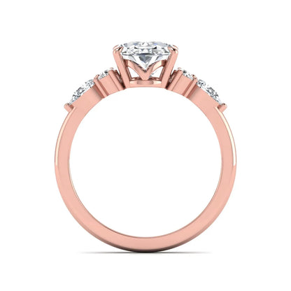 Oval Seven Stone Lab Grown Diamond Engagement Ring featuring a 10.00 × 7.00 mm oval-cut center diamond with round and pear-cut side diamonds in a multi-prong setting in rose gold