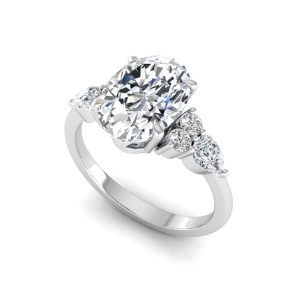 Oval Seven Stone Lab Grown Diamond Engagement Ring featuring a 10.00 × 7.00 mm oval-cut center diamond with round and pear-cut side diamonds in a multi-prong setting in white gold