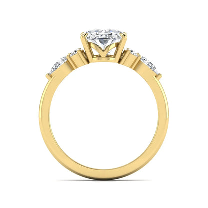 Oval Seven Stone Lab Grown Diamond Engagement Ring featuring a 10.00 × 7.00 mm oval-cut center diamond with round and pear-cut side diamonds in a multi-prong setting in yellow gold