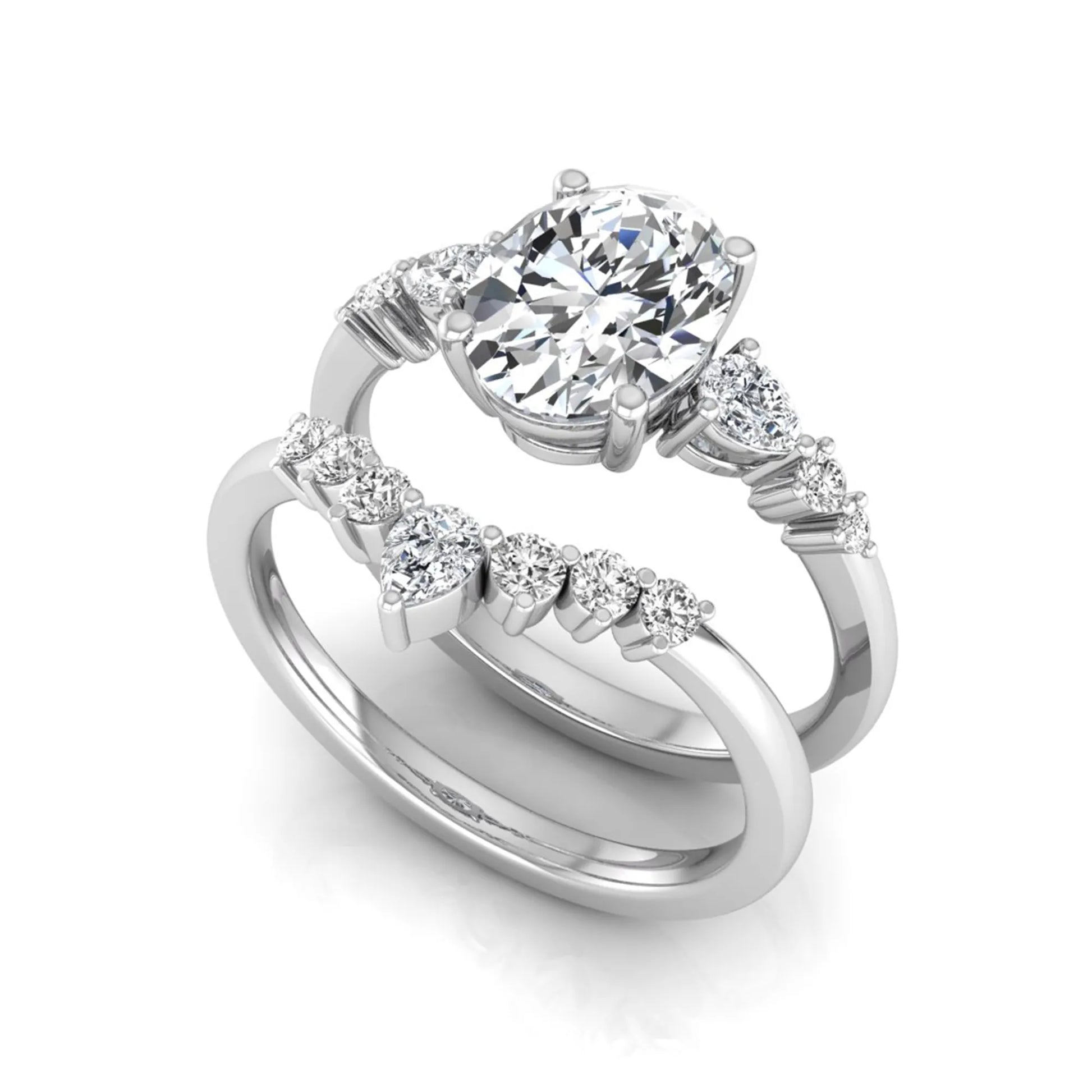 Oval cut lab grown diamond bridal ring set with pear and round side diamonds in white gold tone