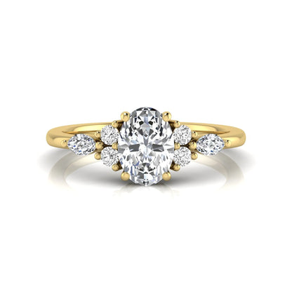Oval cut lab grown diamond engagement ring with marquise and round side diamonds in yellow gold tone