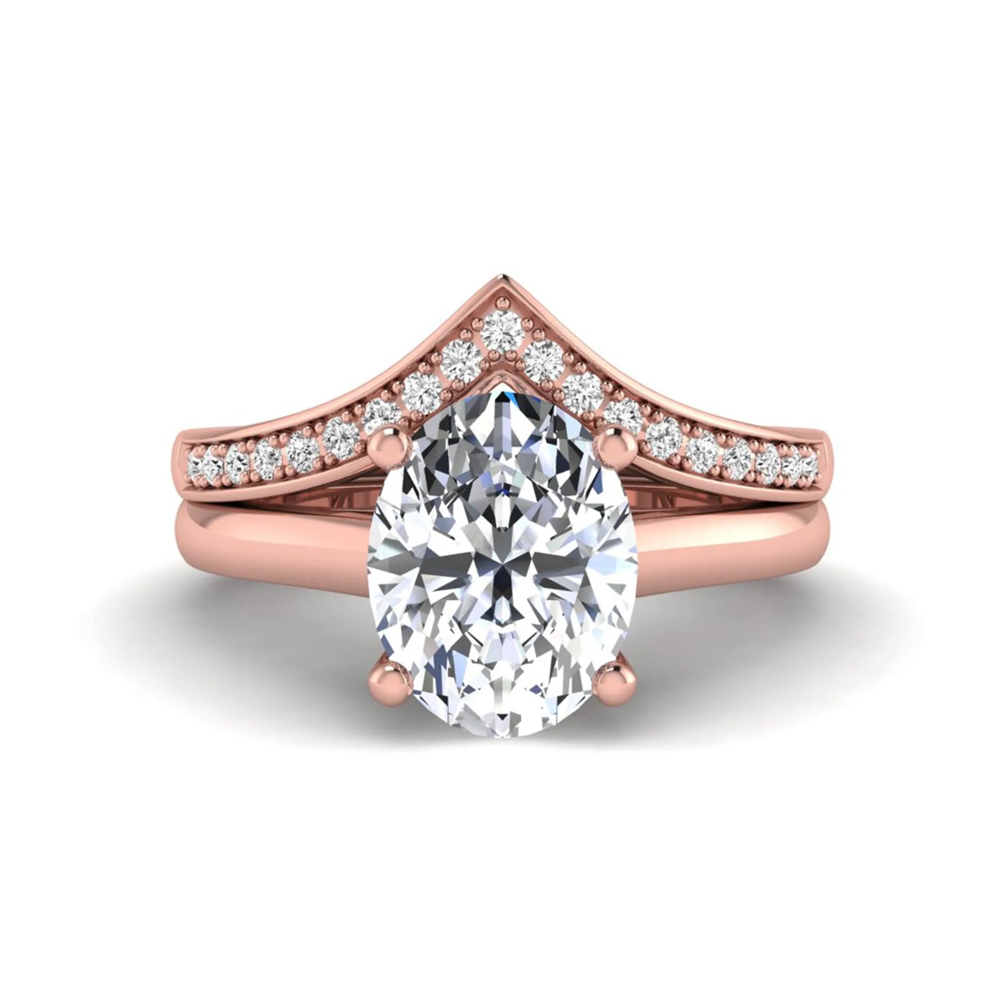 Oval cut lab grown diamond bridal ring set featuring a four-prong solitaire engagement ring with a pavé chevron V-shaped wedding band in a rose gold finish.