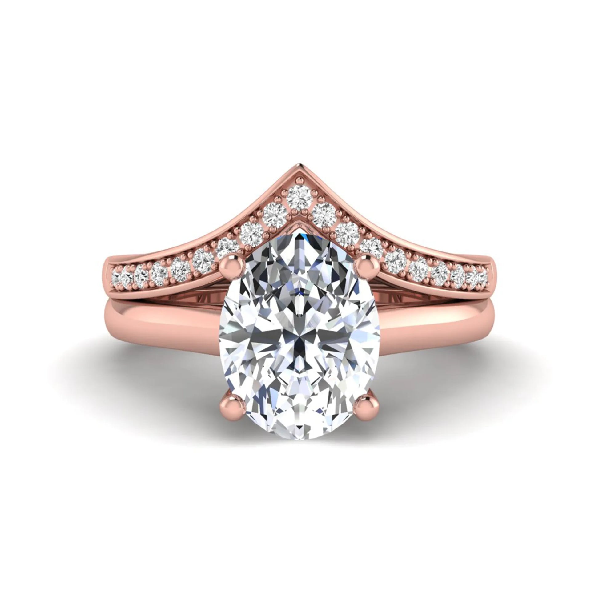 Oval cut lab grown diamond bridal ring set featuring a four-prong solitaire engagement ring with a pavé chevron V-shaped wedding band in a rose gold finish.