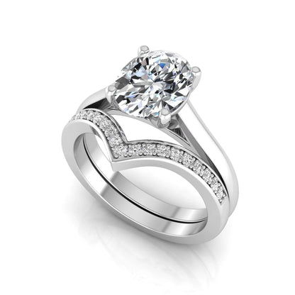 Oval cut lab grown diamond bridal ring set featuring a four-prong solitaire engagement ring with a pavé chevron V-shaped wedding band in a white gold finish.