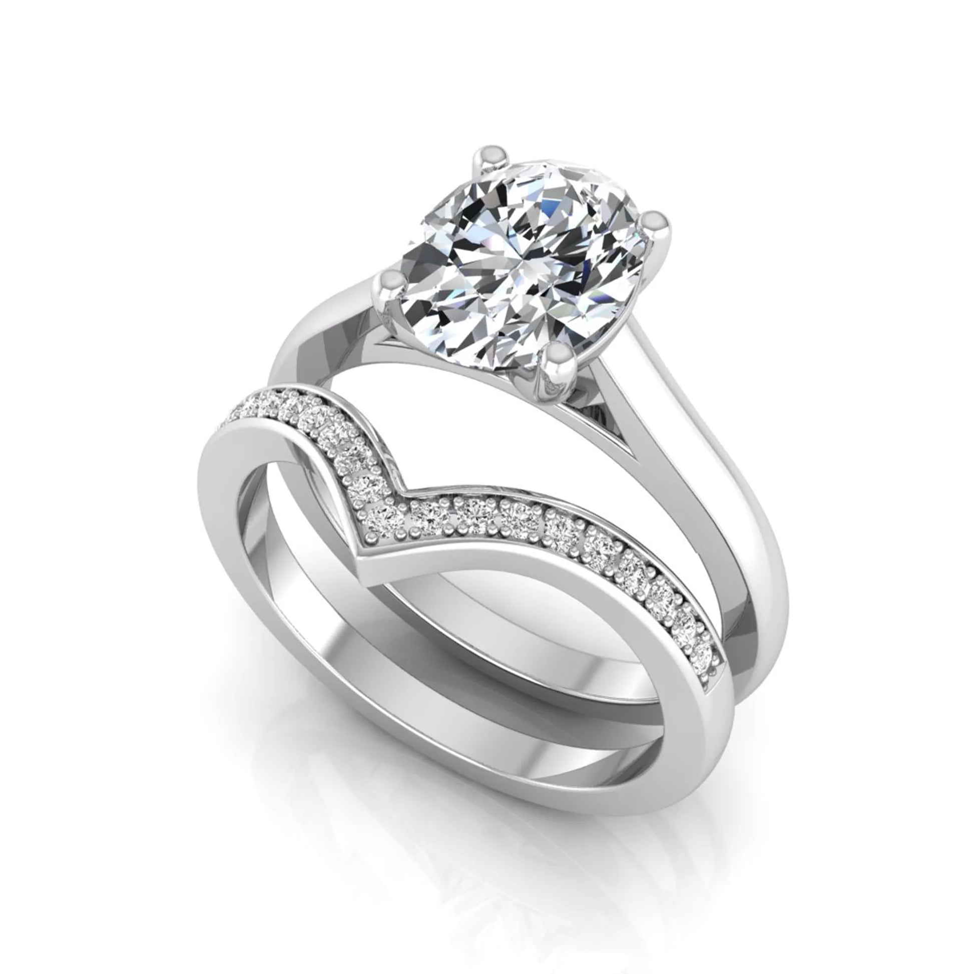 Oval cut lab grown diamond bridal ring set featuring a four-prong solitaire engagement ring with a pavé chevron V-shaped wedding band in a white gold finish.