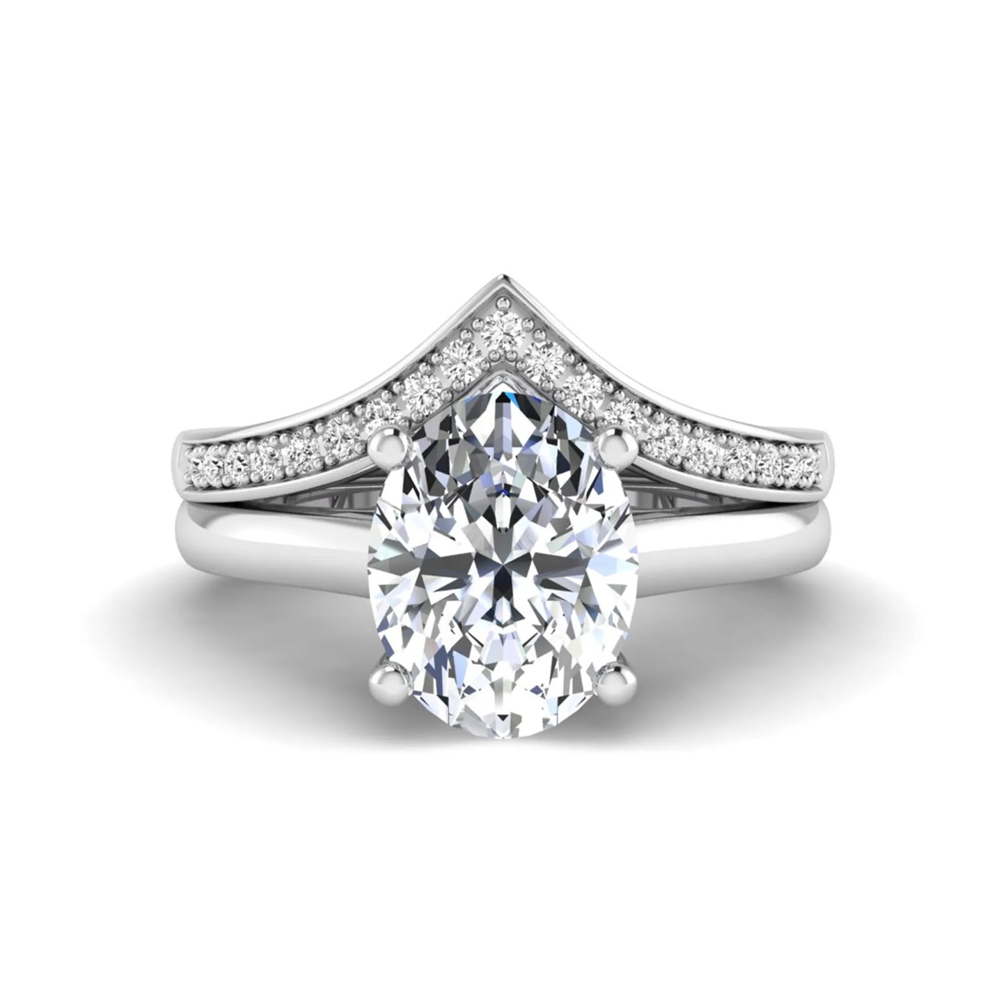 Oval cut lab grown diamond bridal ring set featuring a four-prong solitaire engagement ring with a pavé chevron V-shaped wedding band in a white gold finish.
