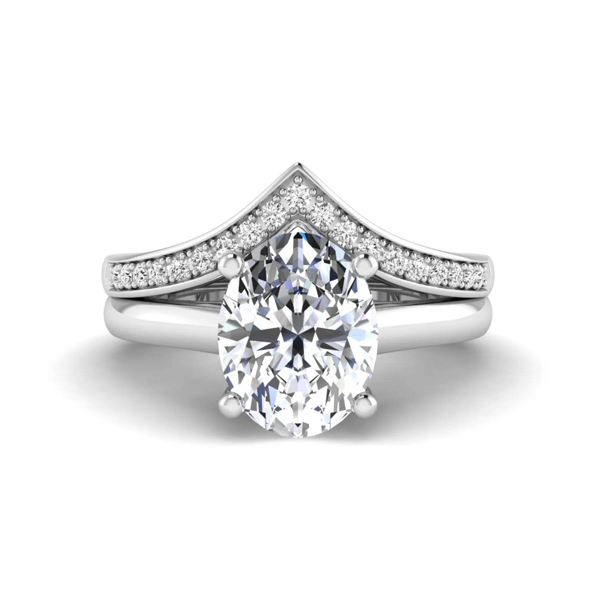 Oval cut lab grown diamond bridal ring set featuring a four-prong solitaire engagement ring with a pavé chevron V-shaped wedding band in a white gold finish.