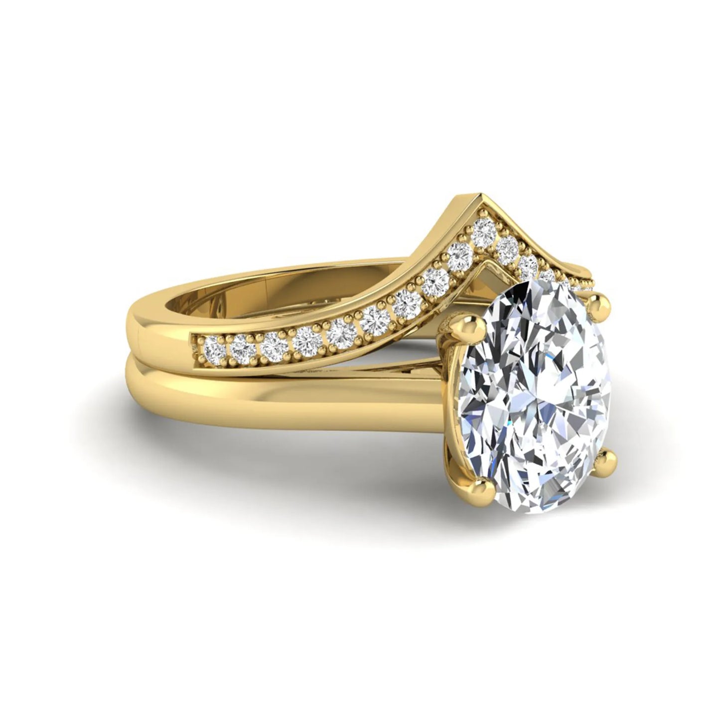 Oval cut lab grown diamond bridal ring set featuring a four-prong solitaire engagement ring with a pavé chevron V-shaped wedding band in a yellow gold finish.