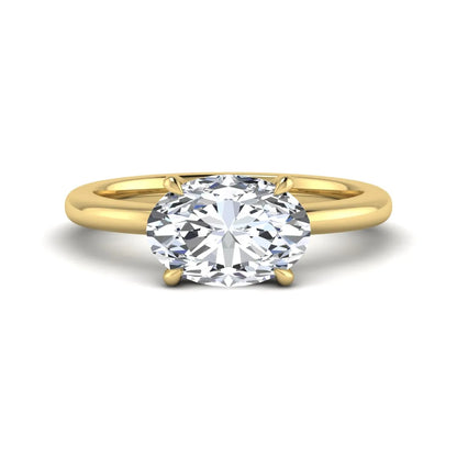 IGI Certified 1.45 carat oval cut lab grown diamond solitaire engagement ring with a polished yellow gold band.
