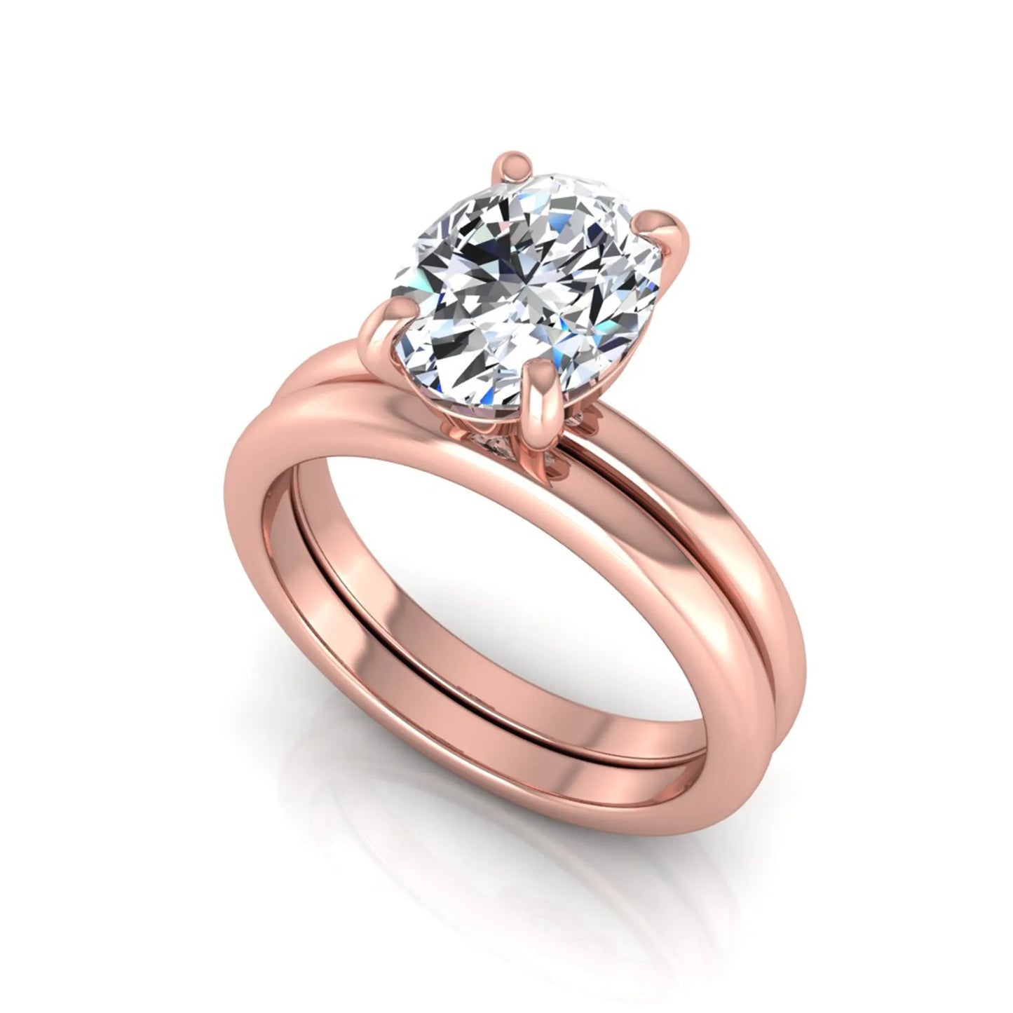 Oval cut lab grown diamond solitaire engagement ring with a matching plain gold wedding band in rose gold