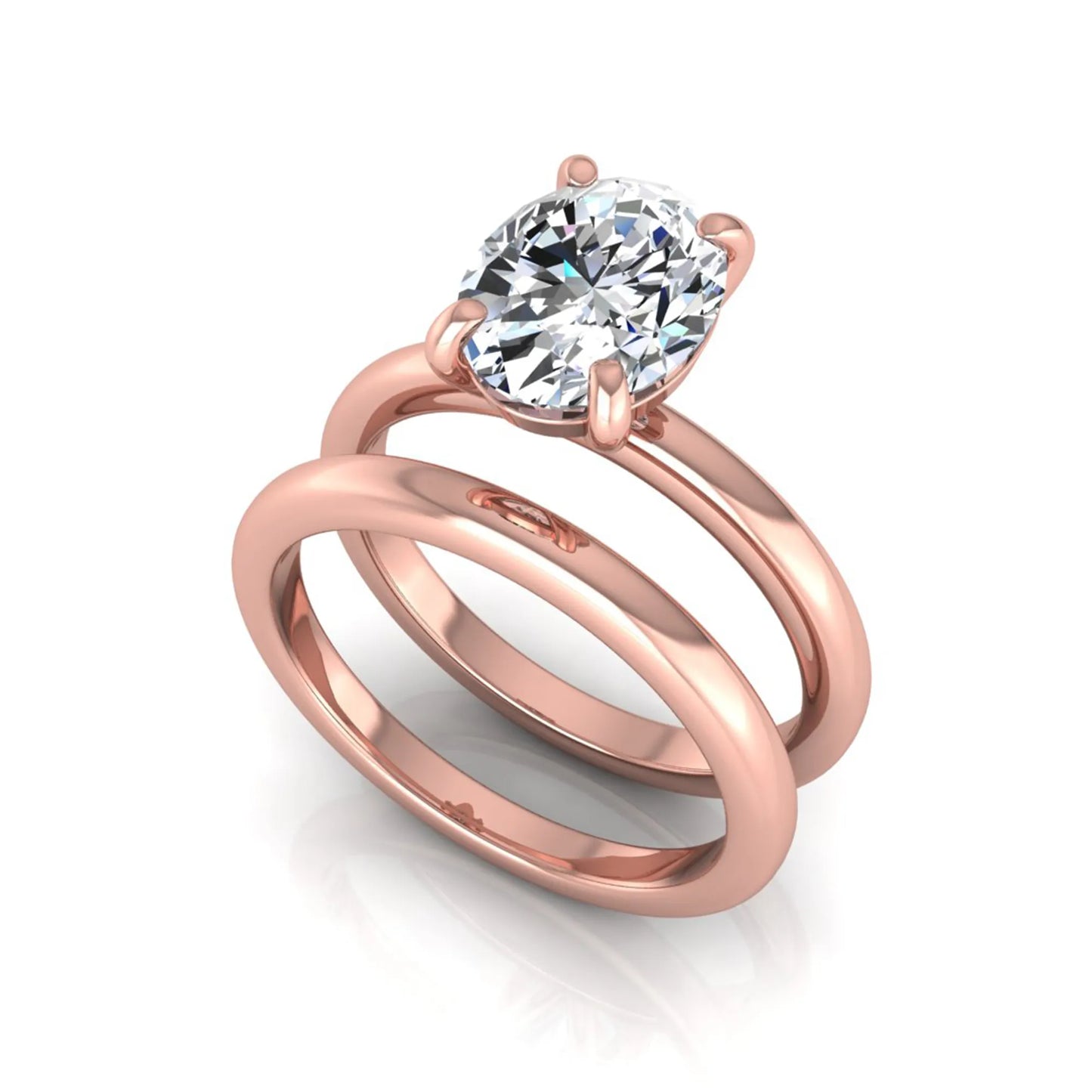 Oval cut lab grown diamond solitaire engagement ring with a matching plain gold wedding band in rose gold