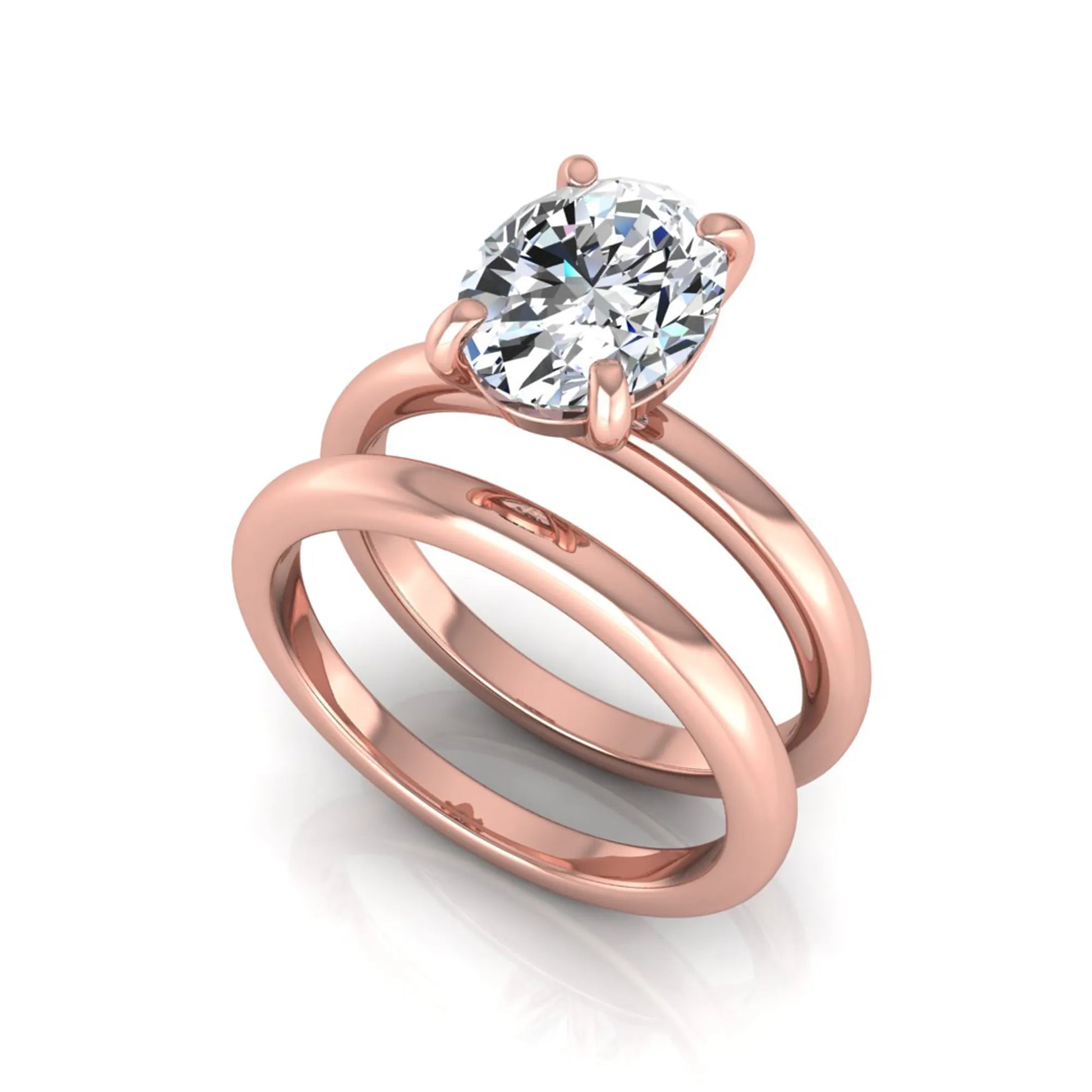 Oval cut lab grown diamond solitaire engagement ring with a matching plain gold wedding band in rose gold