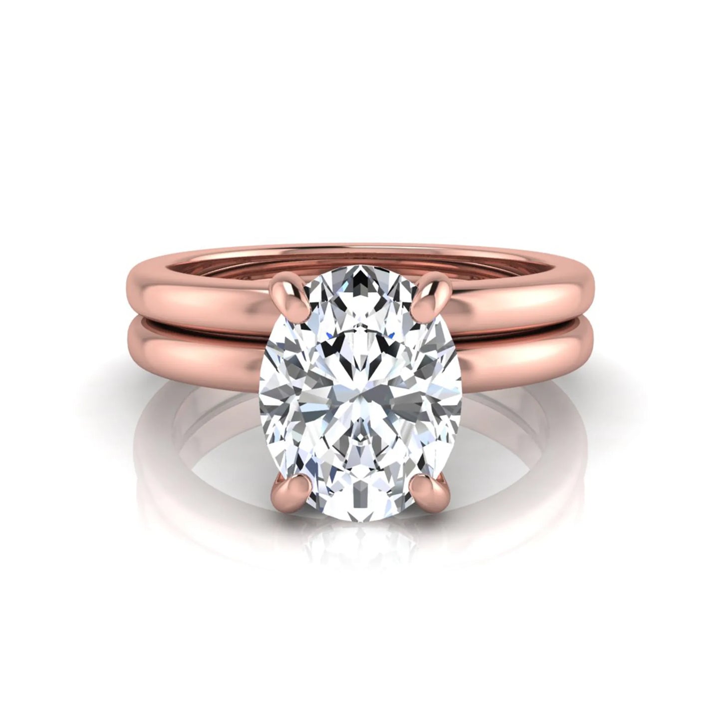 Oval cut lab grown diamond solitaire engagement ring with a matching plain gold wedding band in rose gold