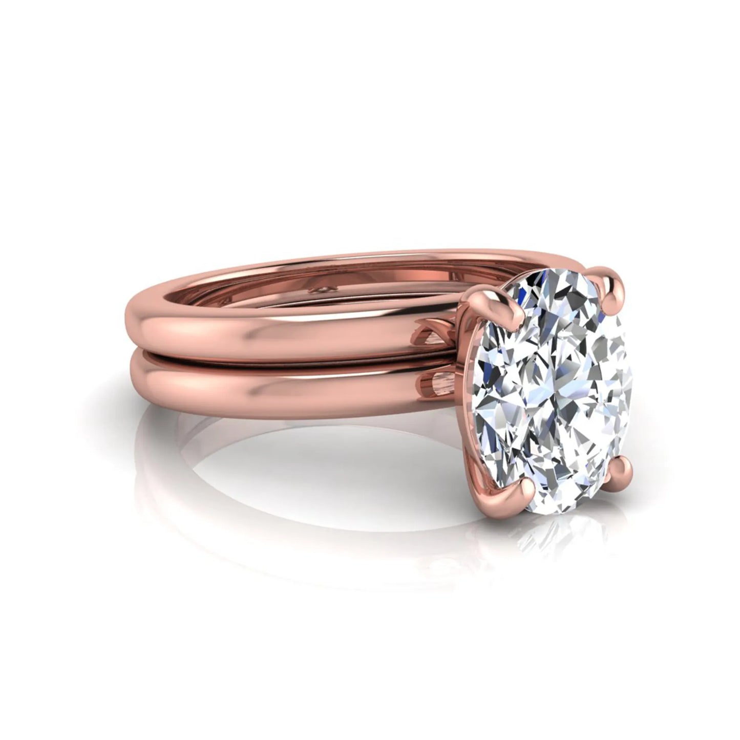 Oval cut lab grown diamond solitaire engagement ring with a matching plain gold wedding band in rose gold
