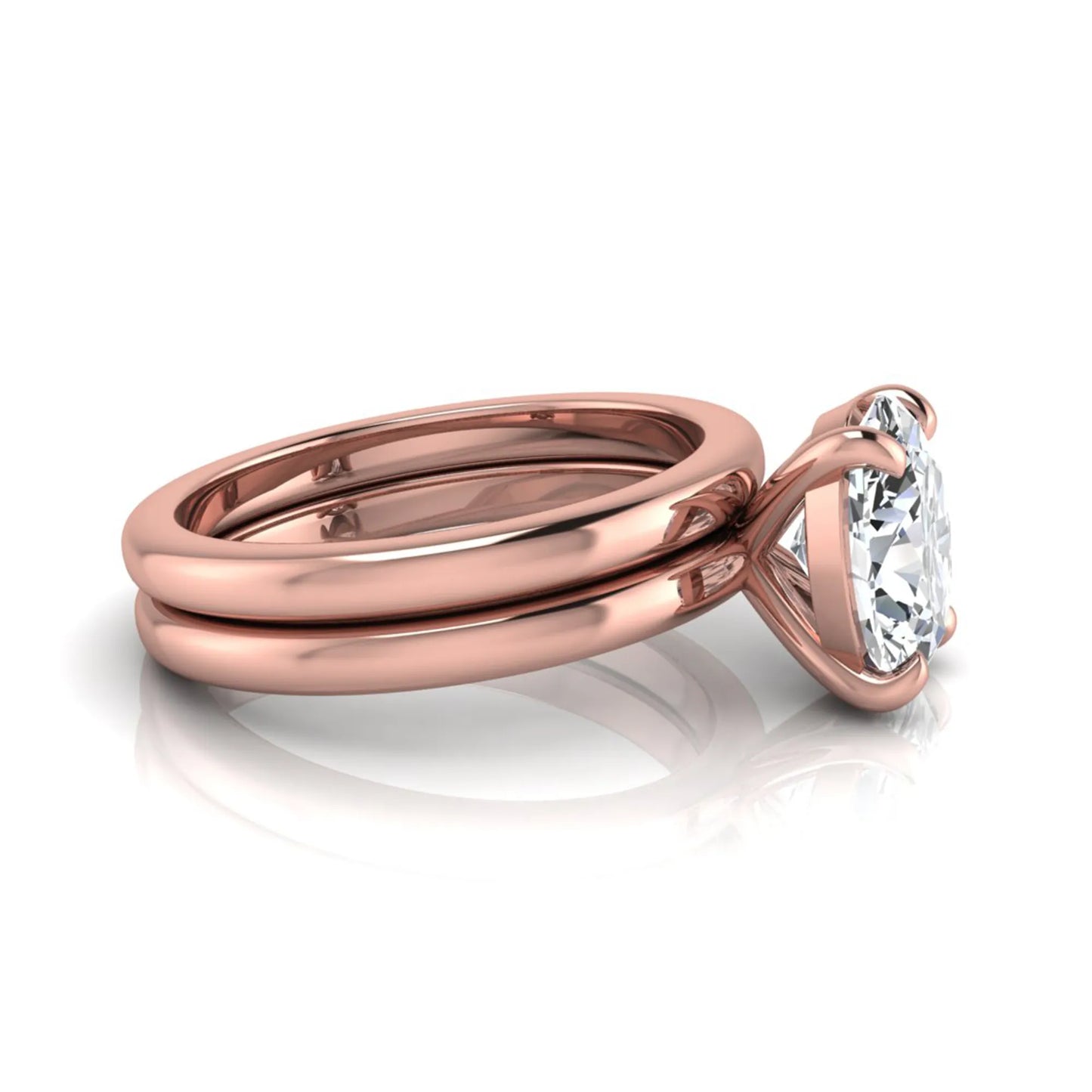 Oval cut lab grown diamond solitaire engagement ring with a matching plain gold wedding band in rose gold