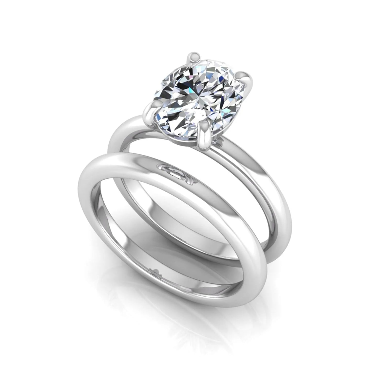 Oval cut lab grown diamond solitaire engagement ring with a matching plain gold wedding band in white gold