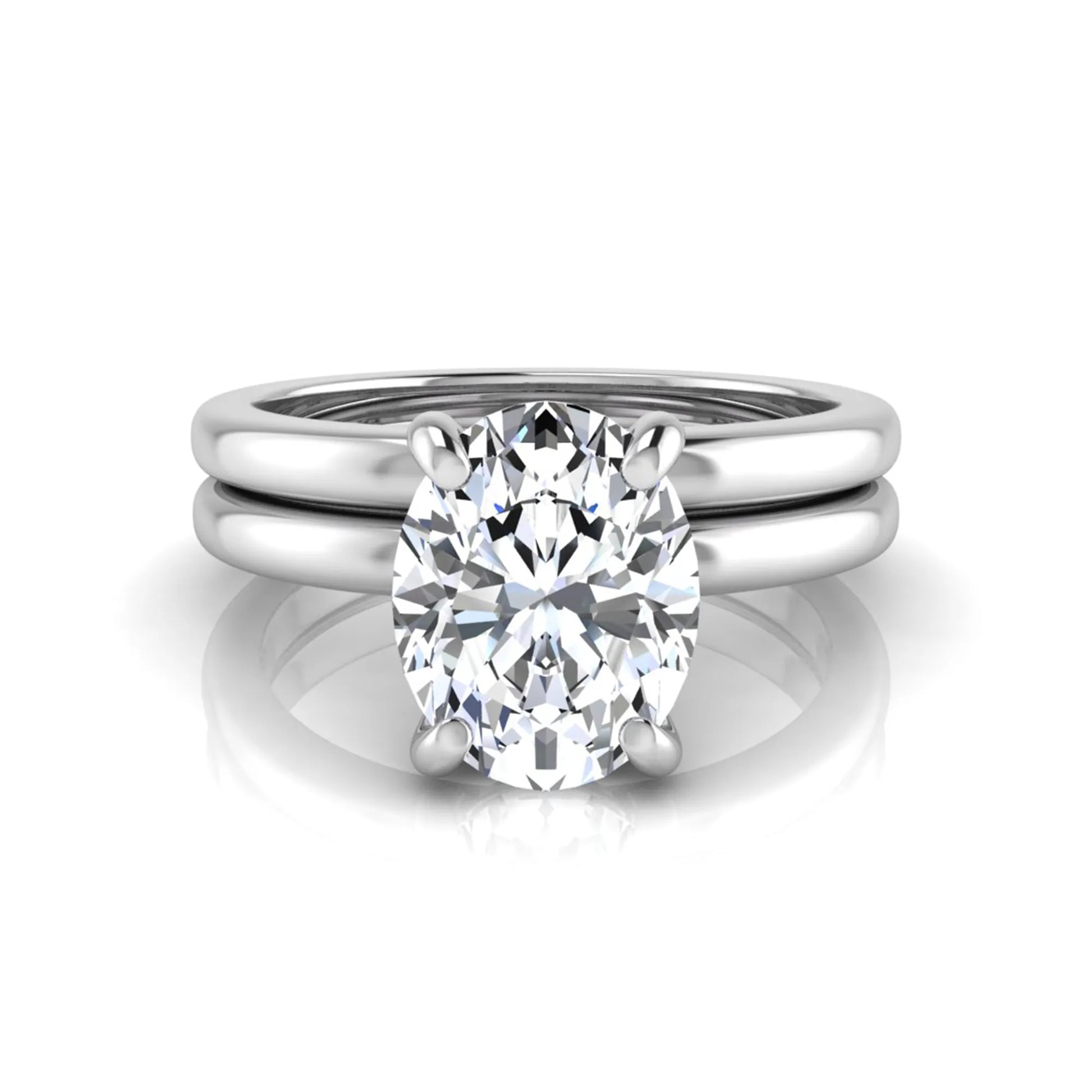 Oval cut lab grown diamond solitaire engagement ring with a matching plain gold wedding band in white gold