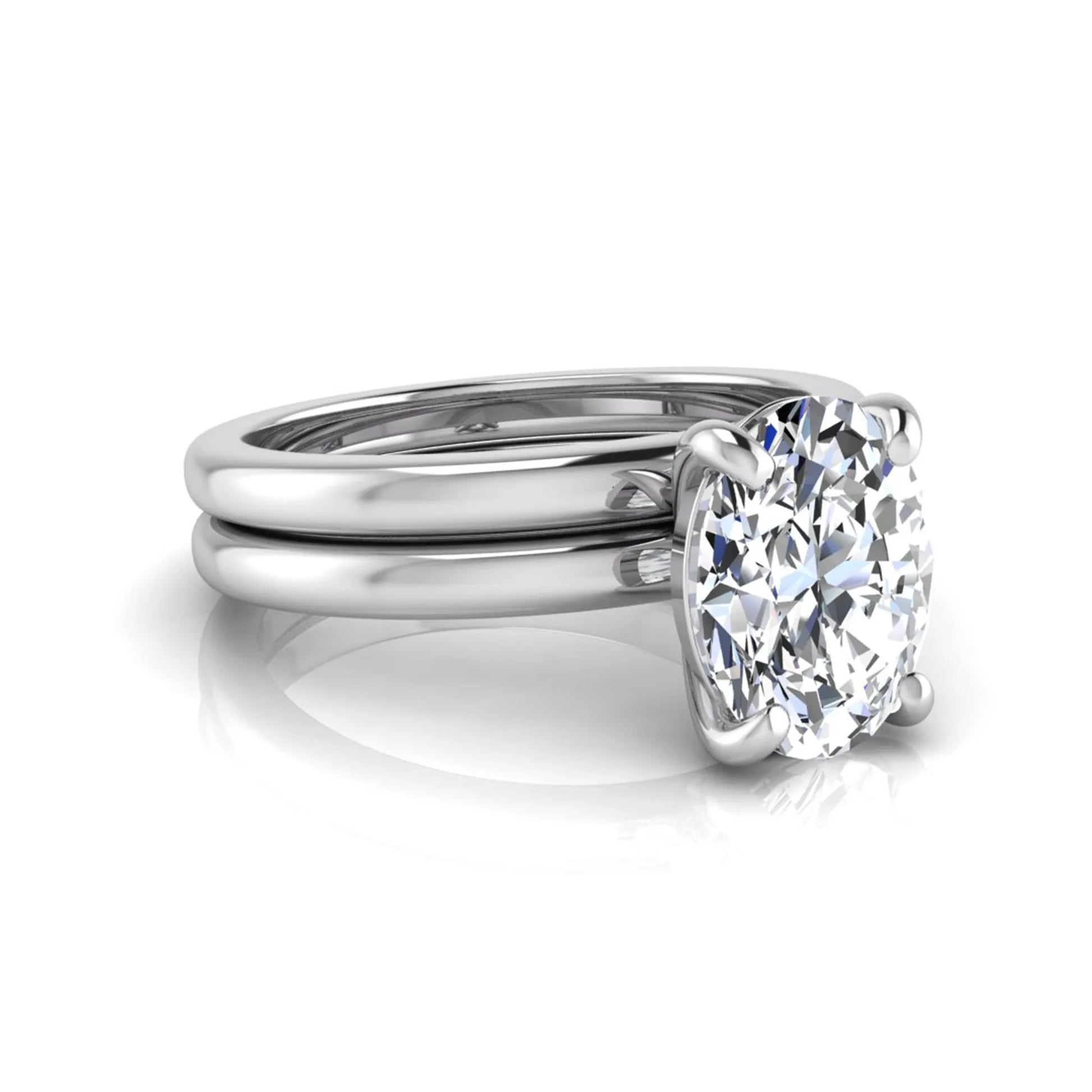 Oval cut lab grown diamond solitaire engagement ring with a matching plain gold wedding band in white gold