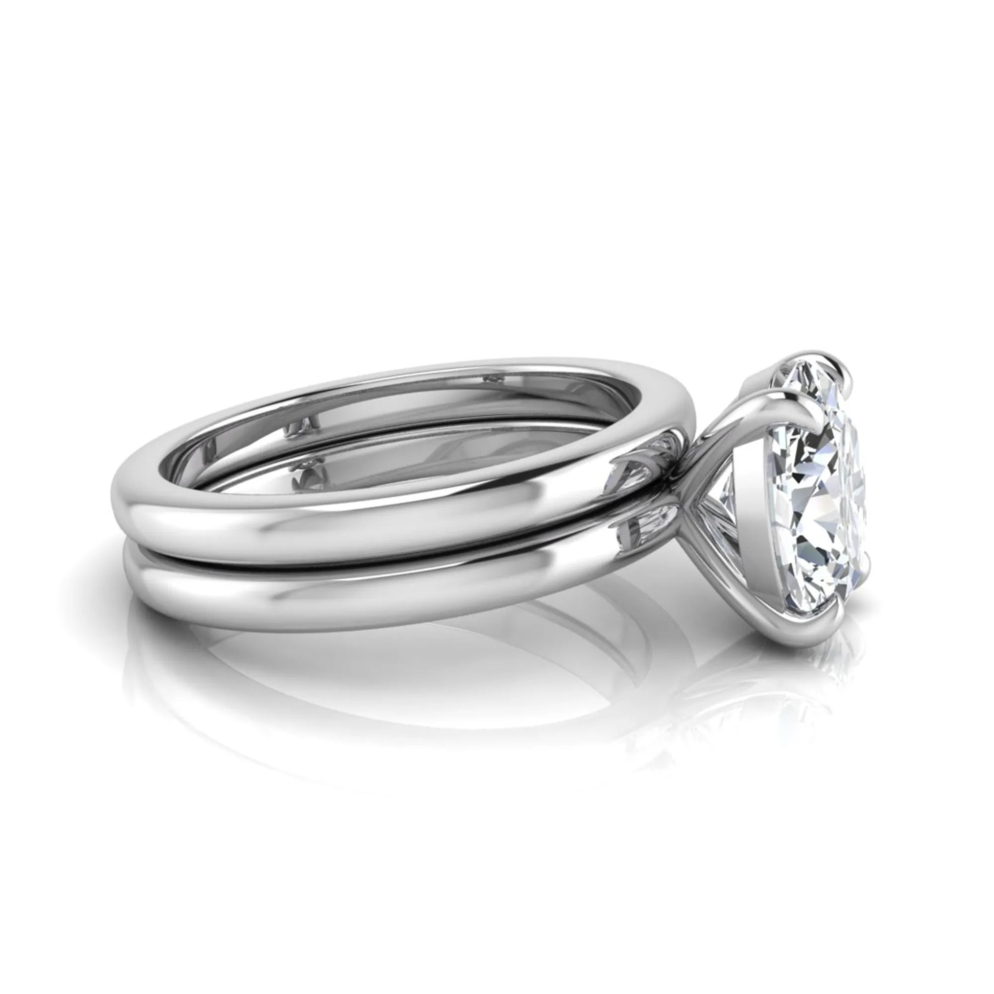 Oval cut lab grown diamond solitaire engagement ring with a matching plain gold wedding band in white gold