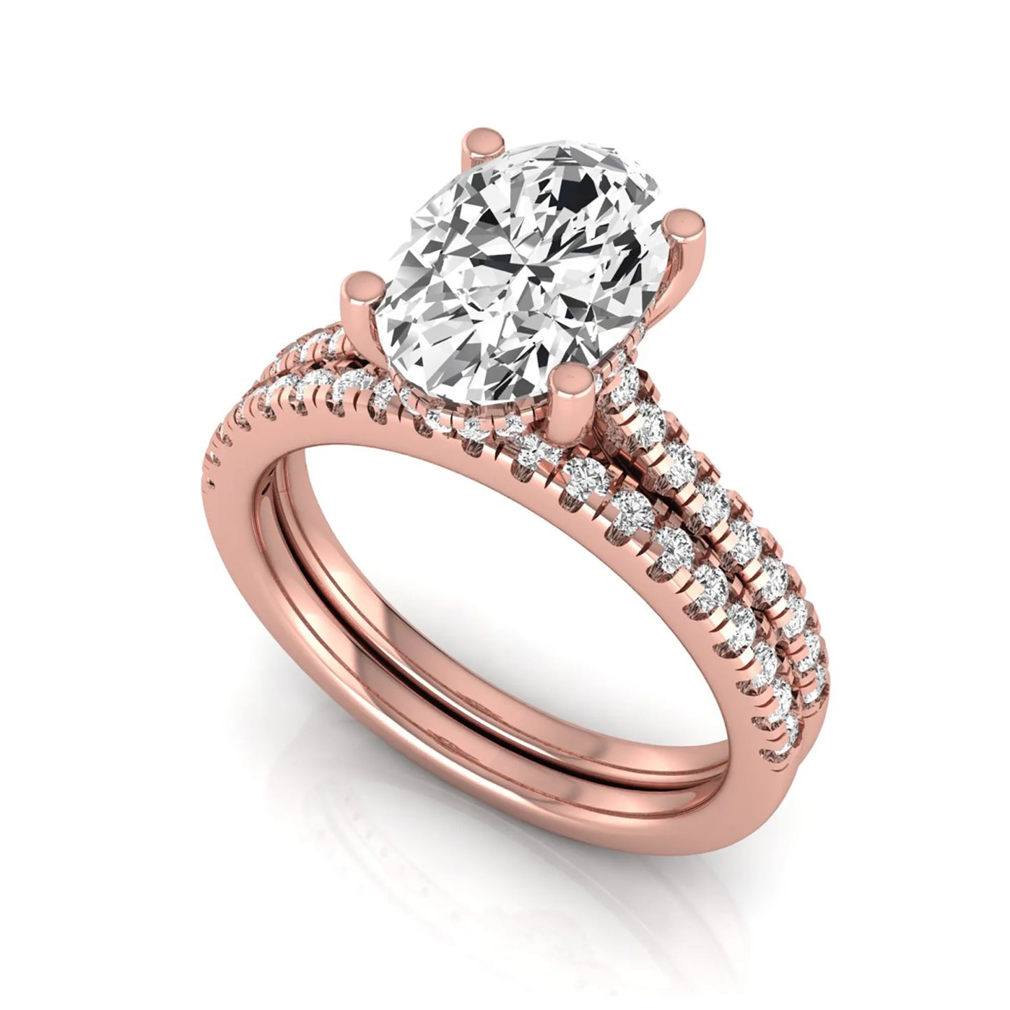 Oval cut lab grown diamond solitaire bridal ring set featuring a four-prong center diamond with pavé diamond engagement ring and matching pavé wedding band in rose gold tone.