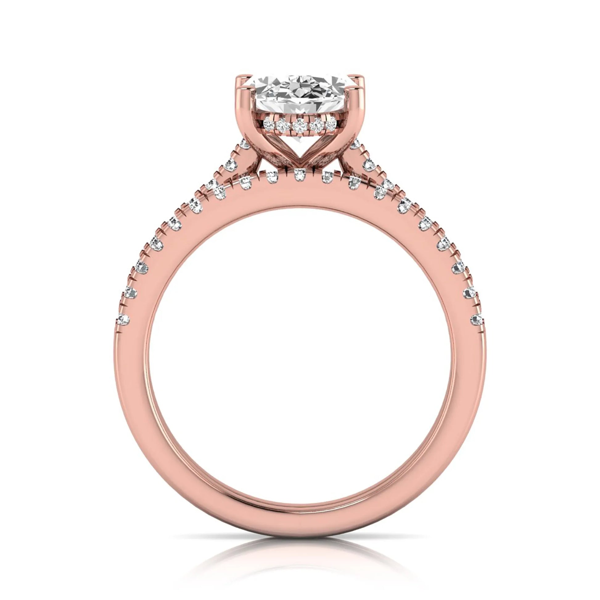 Oval cut lab grown diamond solitaire bridal ring set featuring a four-prong center diamond with pavé diamond engagement ring and matching pavé wedding band in rose gold tone.