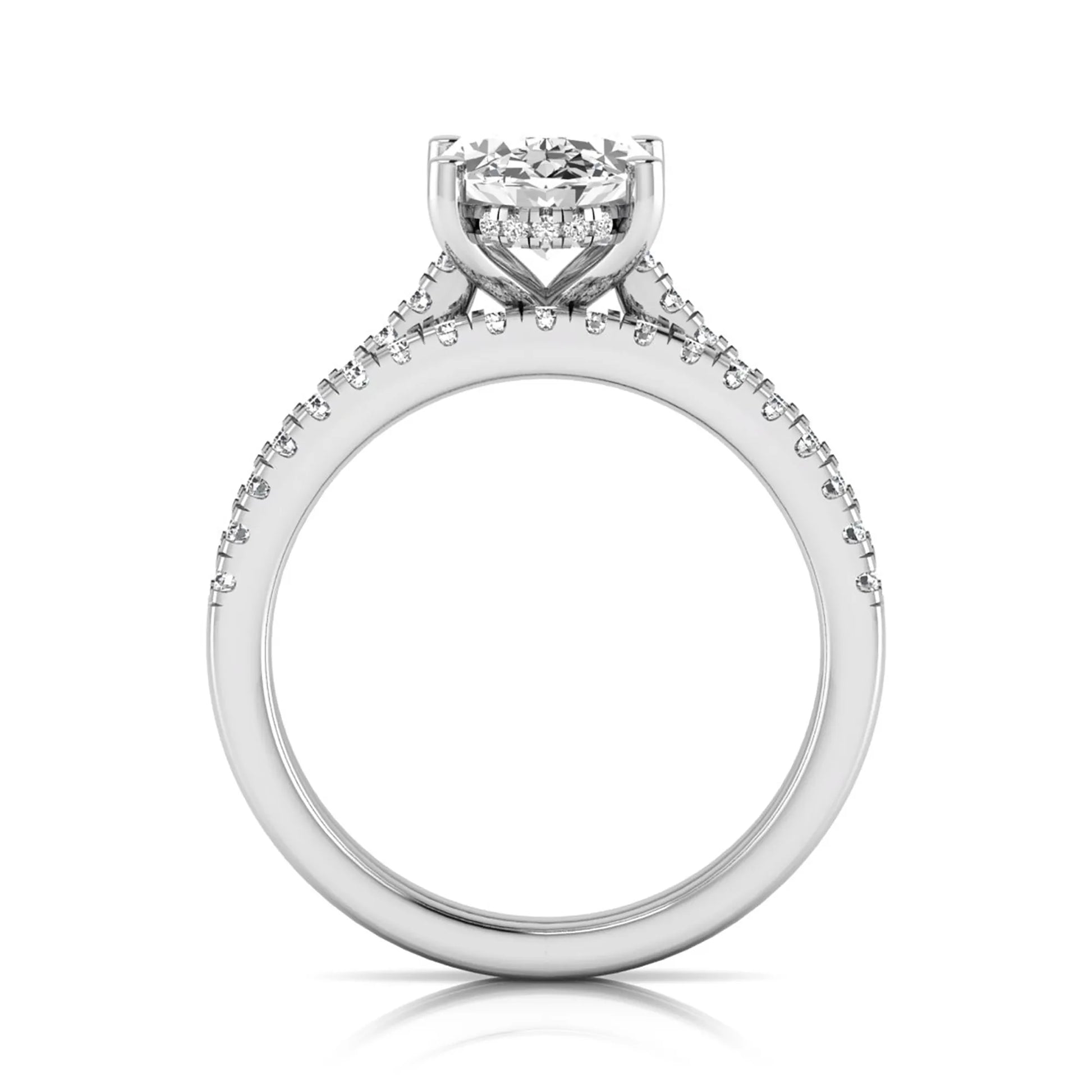 Oval cut lab grown diamond solitaire bridal ring set featuring a four-prong center diamond with pavé diamond engagement ring and matching pavé wedding band in white gold tone.