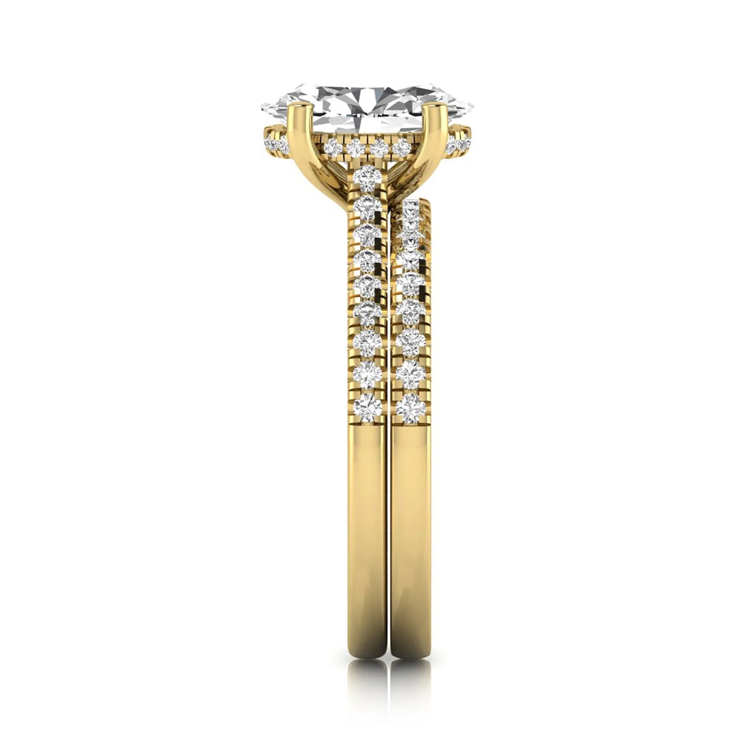 Oval cut lab grown diamond solitaire bridal ring set featuring a four-prong center diamond with pavé diamond engagement ring and matching pavé wedding band in yellow gold tone.