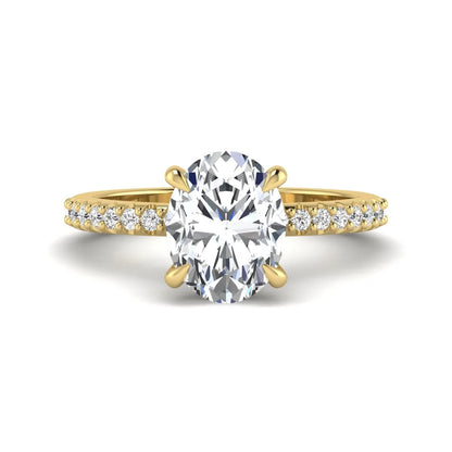 IGI Certified 1.90 carat oval cut lab grown diamond solitaire engagement ring with round pavé diamonds in yellow gold.