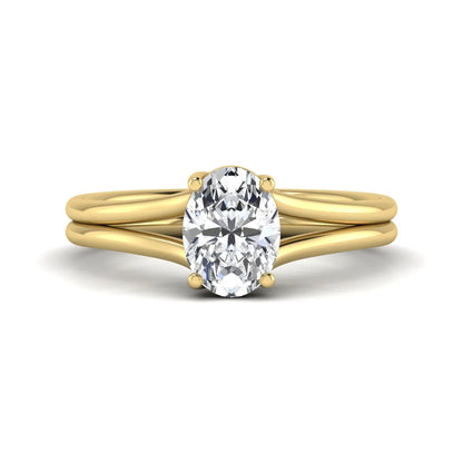 IGI certified 1.22 carat oval cut lab grown diamond solitaire engagement ring with elegant split shank in yellow gold.