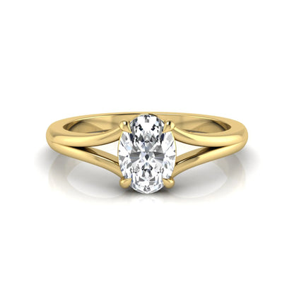 Oval cut lab grown diamond solitaire split shank engagement ring in yellow gold tone