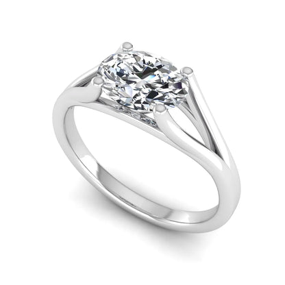 Oval Split Shank Lab Grown Diamond Engagement Ring featuring a 9.00 × 7.00 mm oval-cut center diamond in a four-prong setting with an elegant split shank band in white gold