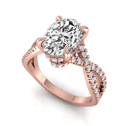 Oval cut lab grown diamond engagement ring featuring a four-prong setting, pavé split shank band, hidden accent diamonds, and a polished rose gold tone finish.