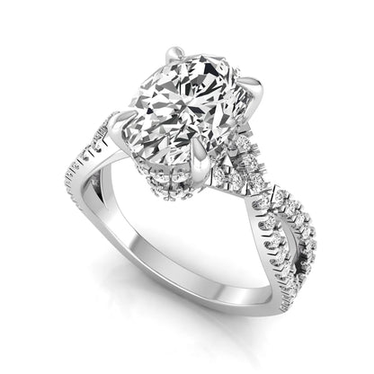 Oval cut lab grown diamond engagement ring featuring a four-prong setting, pavé split shank band, hidden accent diamonds, and a polished white gold tone finish.