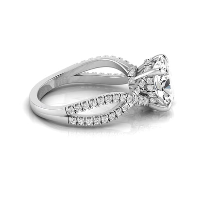 Oval cut lab grown diamond engagement ring featuring a four-prong setting, pavé split shank band, hidden accent diamonds, and a polished white gold tone finish.
