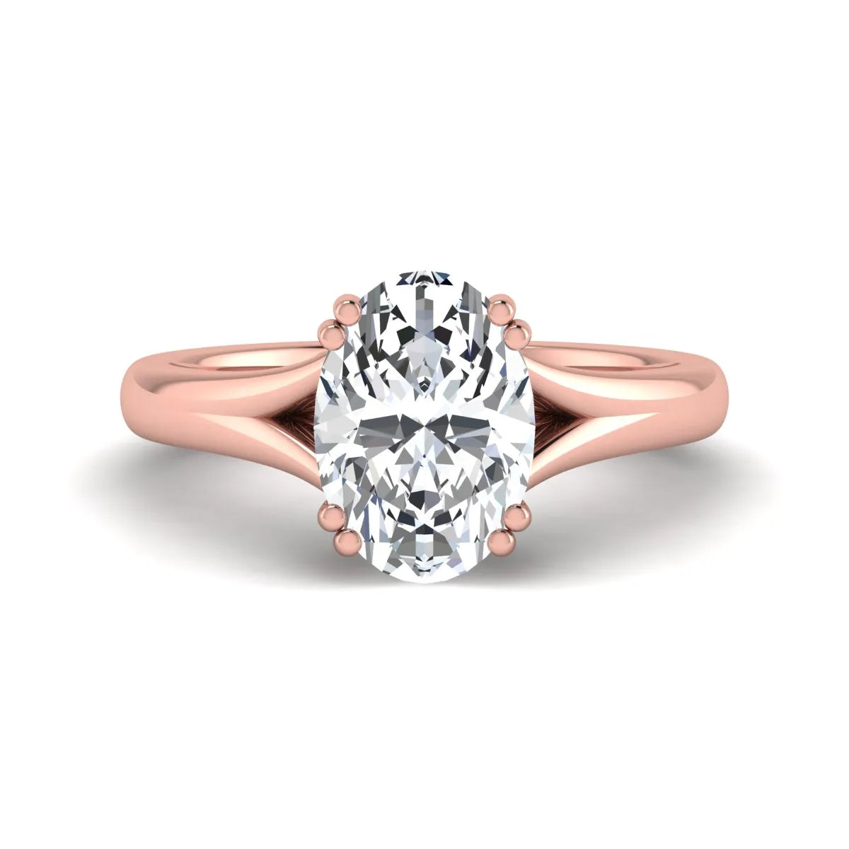 Oval cut lab grown diamond solitaire engagement ring with split shank design and rose gold tone prong setting.
