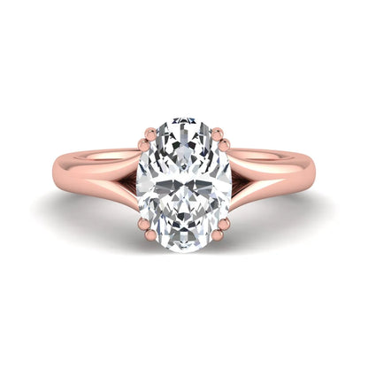 Oval cut lab grown diamond solitaire engagement ring with split shank design and rose gold tone prong setting.