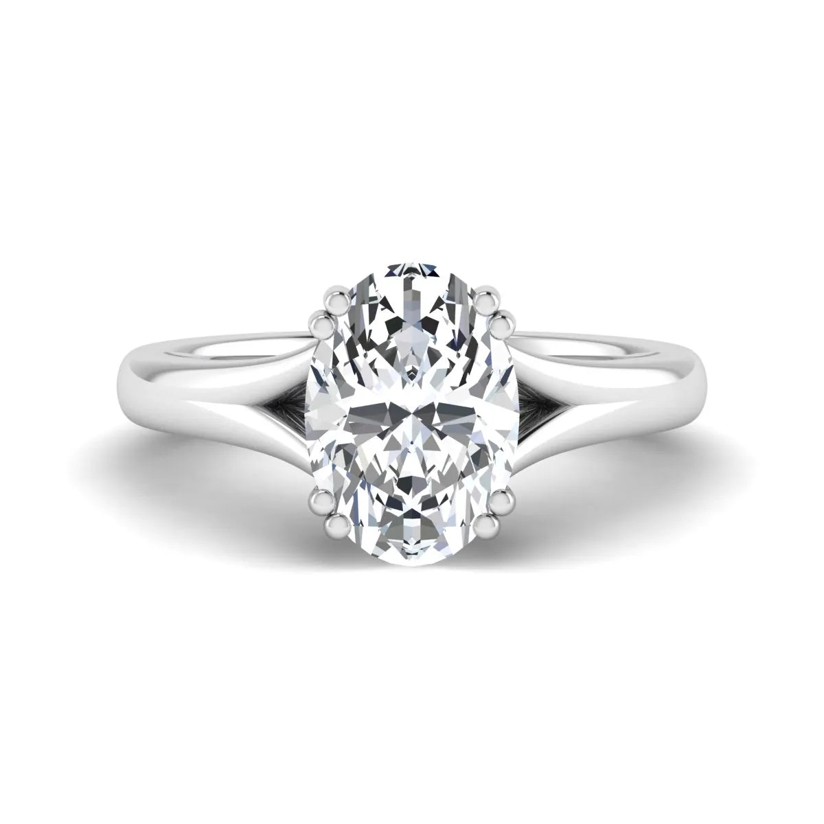 Oval cut lab grown diamond solitaire engagement ring with split shank design and white gold tone prong setting.