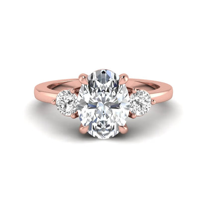 Oval cut three stone lab grown diamond engagement ring featuring a 1.21 carat IGI certified center diamond with round side diamonds in rose gold.