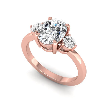 Oval cut three stone lab grown diamond engagement ring featuring a 1.21 carat IGI certified center diamond with round side diamonds in rose gold.
