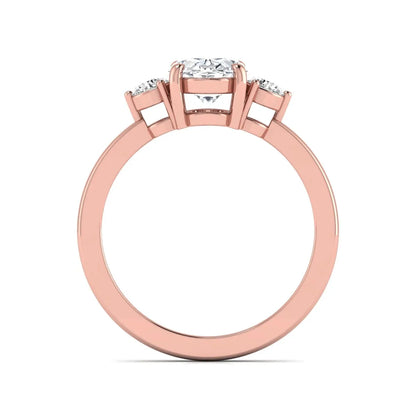 Oval cut three stone lab grown diamond engagement ring featuring a 1.21 carat IGI certified center diamond with round side diamonds in rose gold.