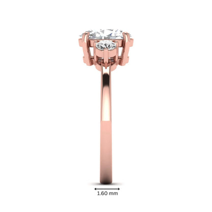 Oval cut three stone lab grown diamond engagement ring featuring a 1.21 carat IGI certified center diamond with round side diamonds in rose gold.