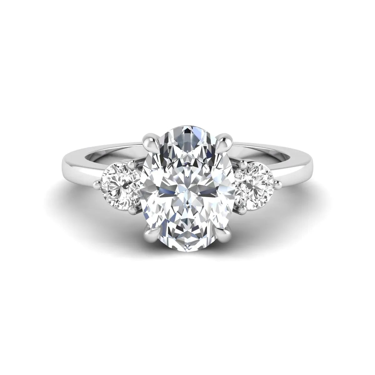 Oval cut three stone lab grown diamond engagement ring featuring a 1.21 carat IGI certified center diamond with round side diamonds in white gold.