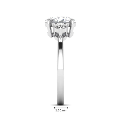 Oval cut three stone lab grown diamond engagement ring featuring a 1.21 carat IGI certified center diamond with round side diamonds in white gold.