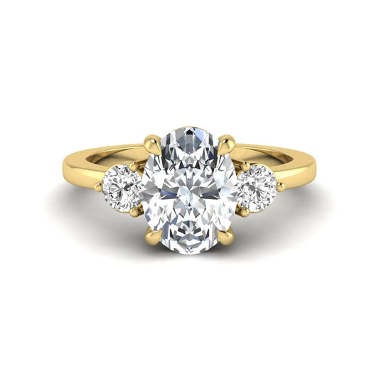 Oval cut three stone lab grown diamond engagement ring featuring a 1.21 carat IGI certified center diamond with round side diamonds in yellow gold.
