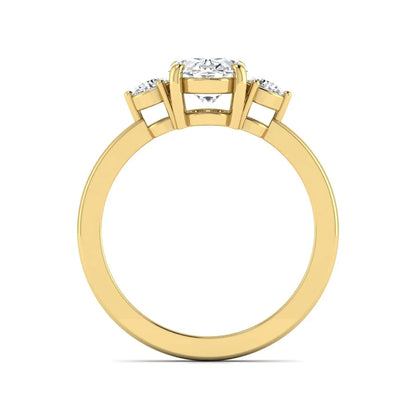 Oval cut three stone lab grown diamond engagement ring featuring a 1.21 carat IGI certified center diamond with round side diamonds in yellow gold.