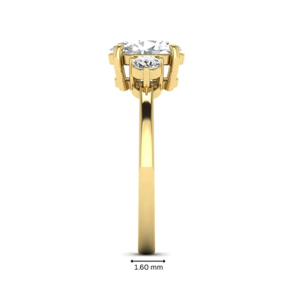 Oval cut three stone lab grown diamond engagement ring featuring a 1.21 carat IGI certified center diamond with round side diamonds in yellow gold.