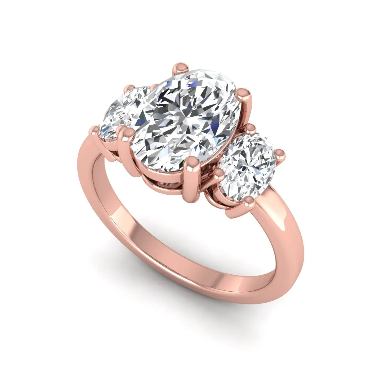 Oval cut three stone lab grown diamond engagement ring featuring an IGI certified center diamond with matching oval side diamonds in rose gold.