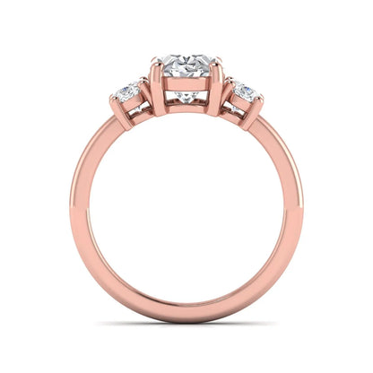 Oval cut three stone lab grown diamond engagement ring featuring an IGI certified center diamond with matching oval side diamonds in rose gold.