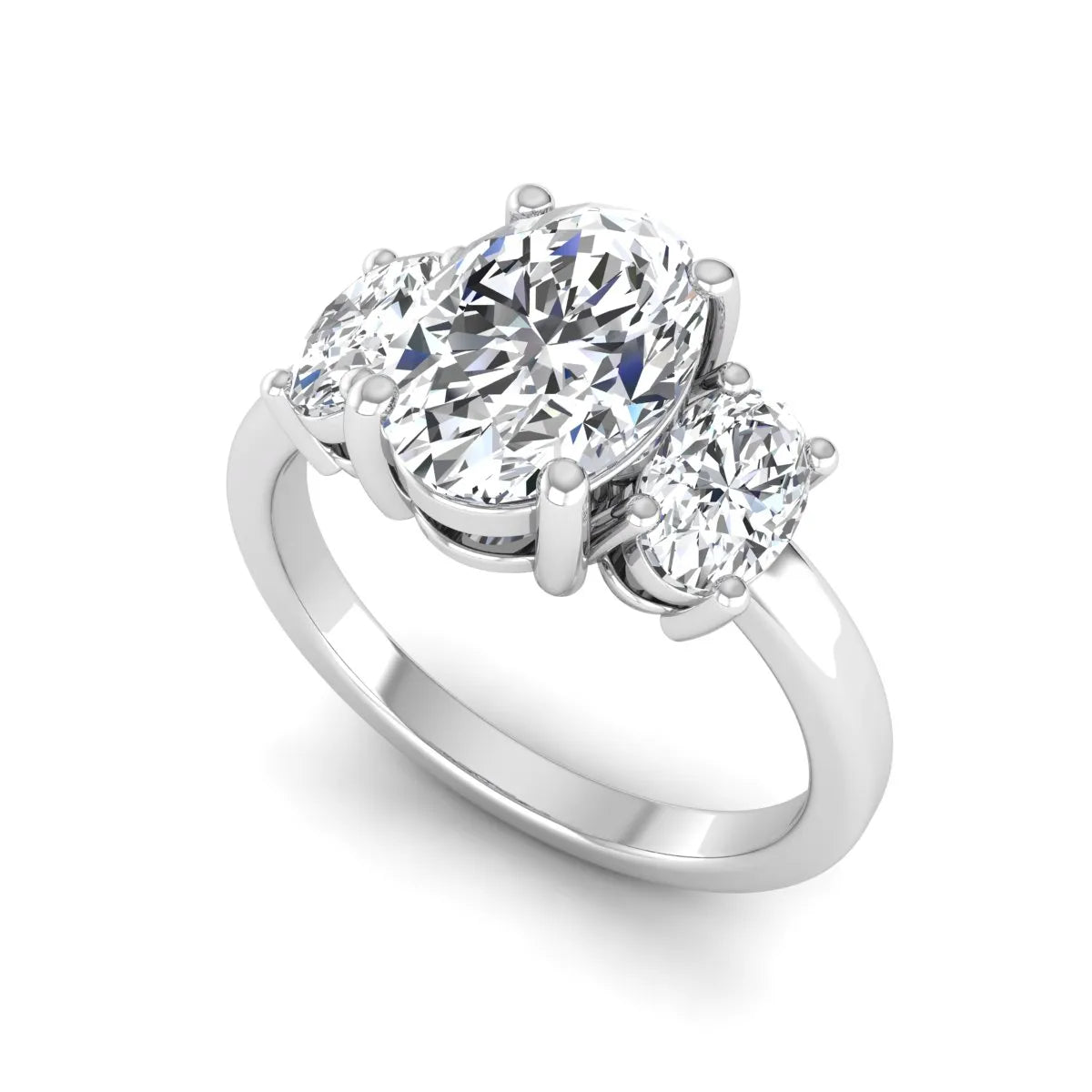 Oval cut three stone lab grown diamond engagement ring featuring an IGI certified center diamond with matching oval side diamonds in white gold.