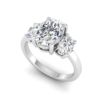Oval cut three stone lab grown diamond engagement ring featuring an IGI certified center diamond with matching oval side diamonds in white gold.
